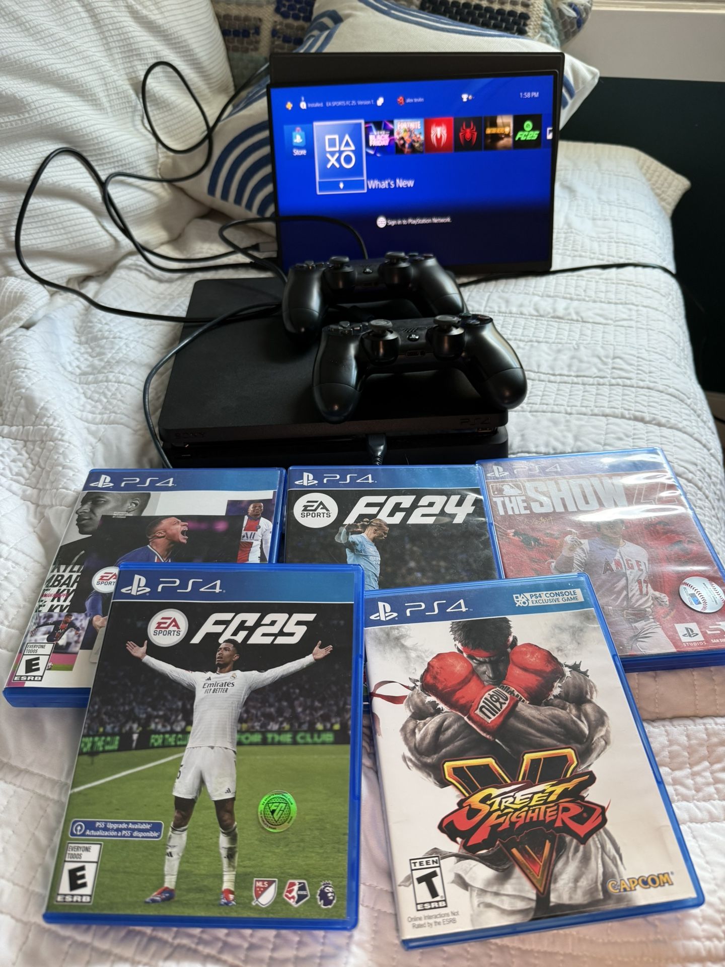 PS4 SLIM BUNDLE, TWO CONTROLLERS, GAMES (FIFA/FC)