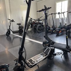 Electric scooter with shock absorption