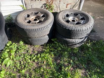 Four 6 lug truck rims with pretty newish tires