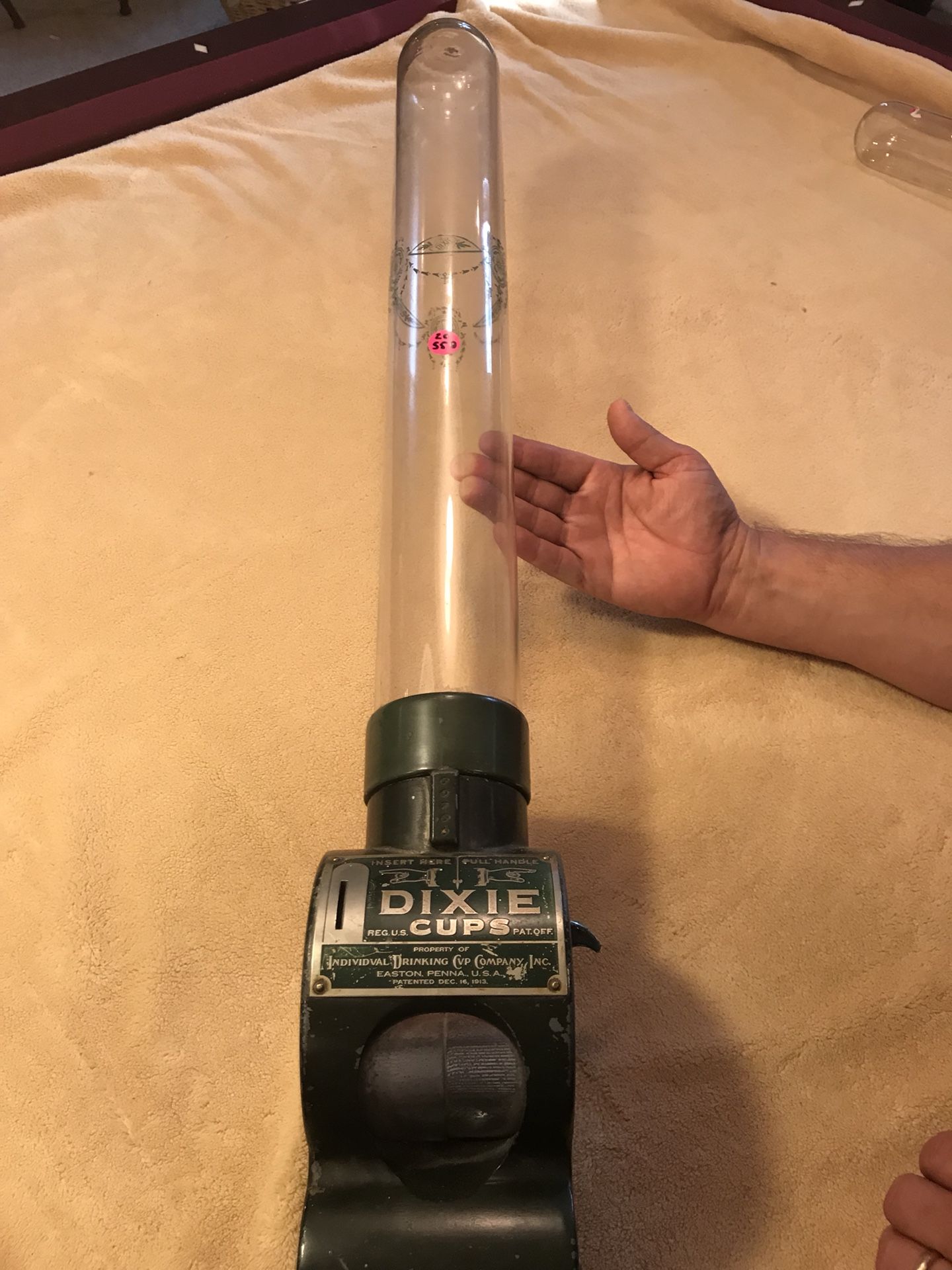 Coin operated Dixie drinking cup dispenser