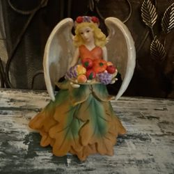 2006 Fall Angel Porcelain Figurine Avon Joyful Flower like new smoke free