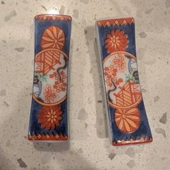 A pair of ceramic chopstick stands