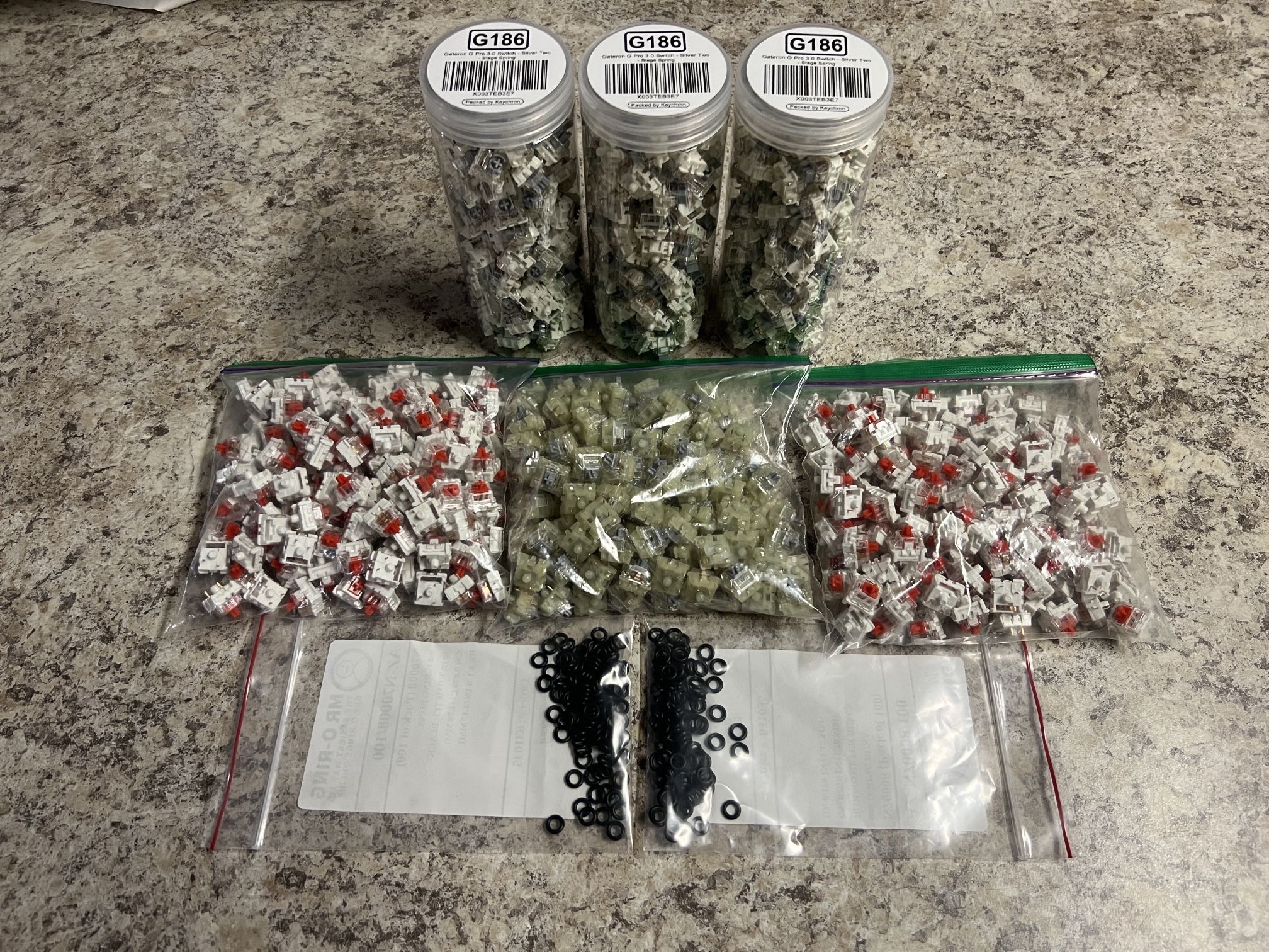 330x Gateron G Pro 3.0 Silver switches + 352x Royal Kludge Red switches + 137x Cherry Silver switches + 200x 70A O-rings