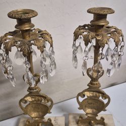 antique brass girandole candelabra with crystal prisms and a marble base. Girandoles are ornate candle holders, often produced in the Victorian era