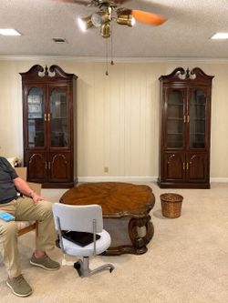 There are two of these beautiful cherry curio/China hutch/bookcases