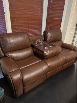 Brown reclining leather sofa w/ console and USB