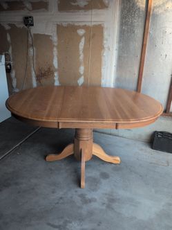 Round Oak Pedestal Dining Table with Leaf
