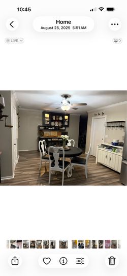 Round dining room table with four chairs