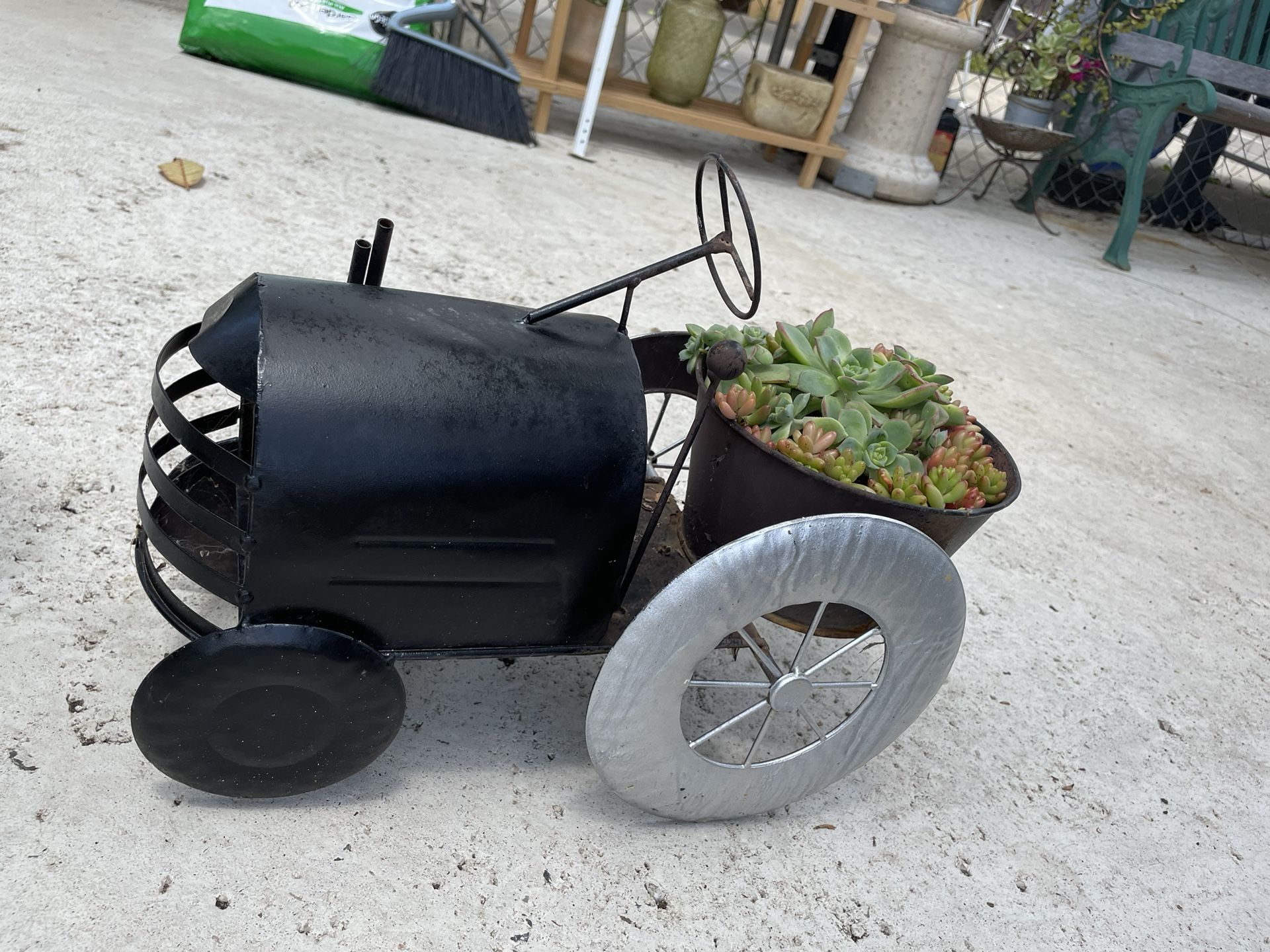 Small Tractor With Plant Base 