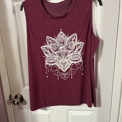 Women’s Size 3X Tunic Length sleeveless top.  Made of 65% Cotton and 35% Polyester Preowned good condition .