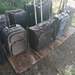 LOTS OF NICE PULL ALONG LUGGAGE 