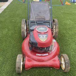 Craftsman 6.5 HP Briggs & Stratton mower. Runs well. Large rear wheels. $130 OBO.