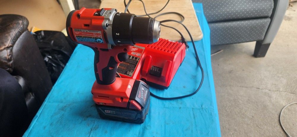 Milwaukee Drill, battery, and Changer