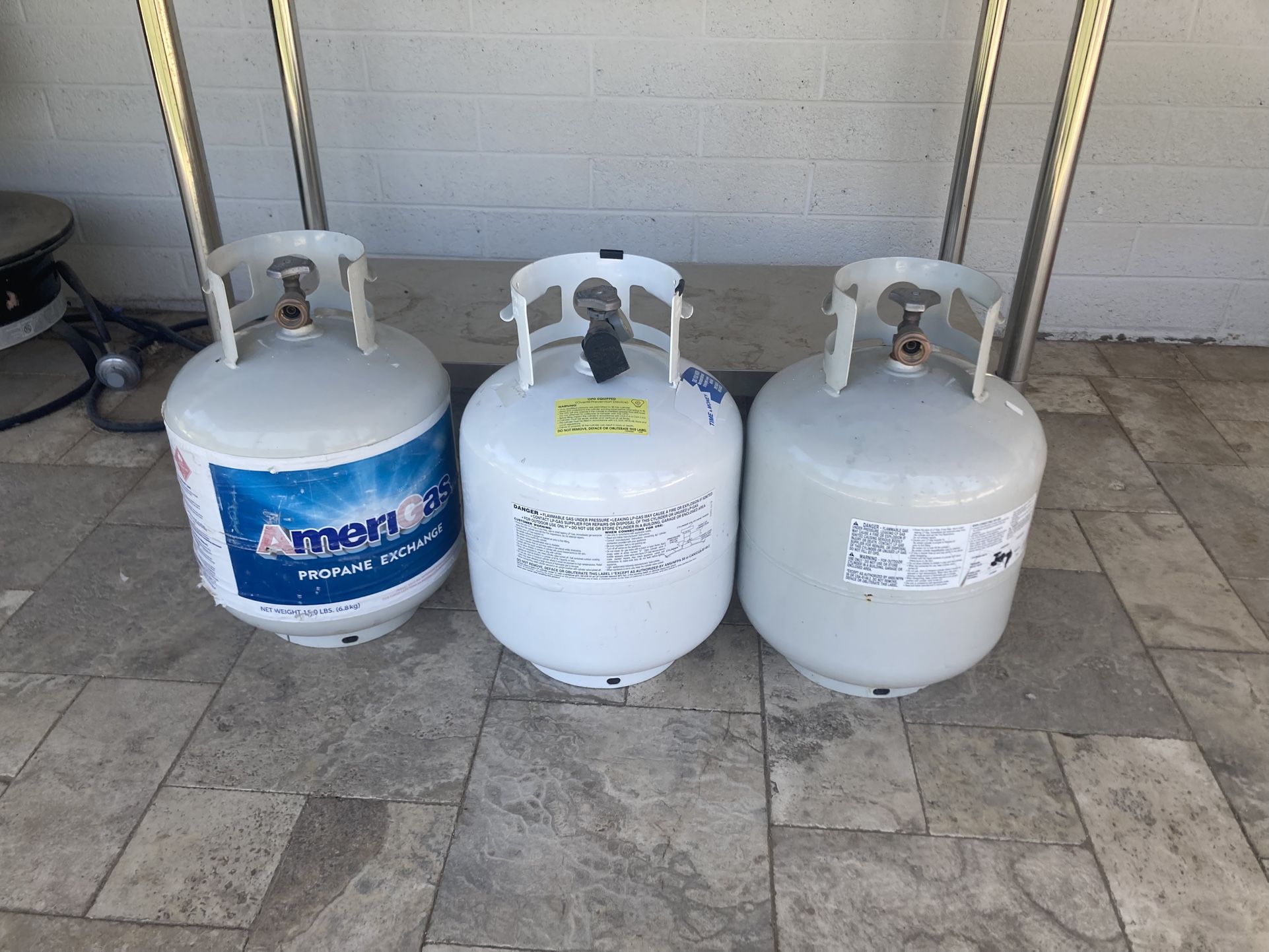 3 Propane Tanks One Full