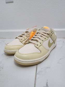New Nike Dunk Low in the Muslin/Team Gold colorway.