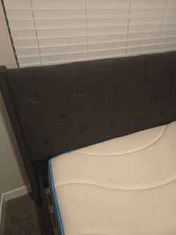 Queen size grey upholstered bed