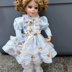 vintage European Scandinavian porcelain curly hair blond blonde doll in ruffled dress on stand, 11"