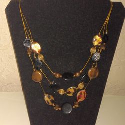 Triple Strand Gold Tone And Amber Tone Necklace 