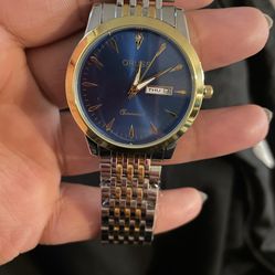 Men’s Blue, Silver, And Gold Watch