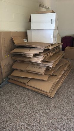 Lot of Flattened Cardboard Moving Boxes