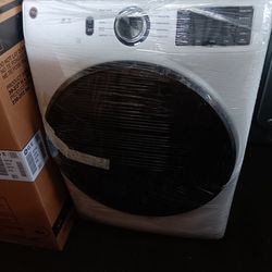 pair of washing machines are new GE brand gas 