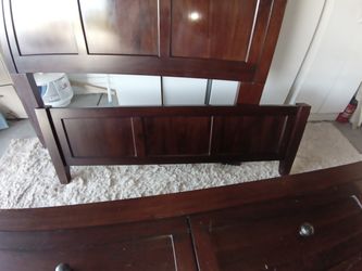 Wooden bed frame with drawers full