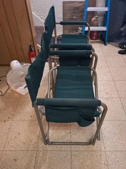 2 green camping chairs