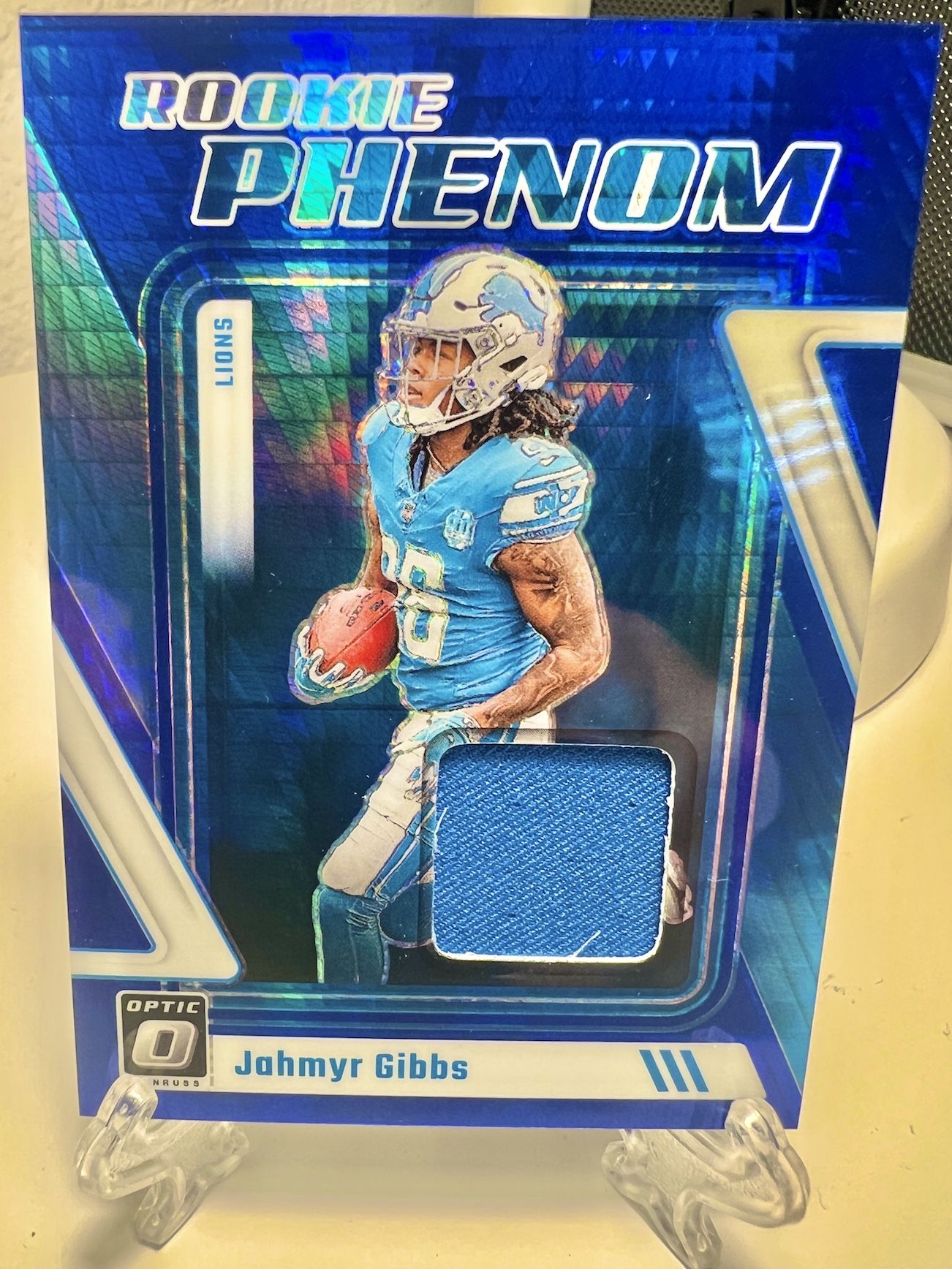 Jahmyr Gibbs 2023 Rookie Optic Hyper Blue Phenom Jersey Patch