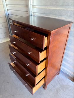Brown wood chest of drawers
