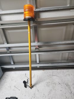 Beacon light with about 5 feet pole.