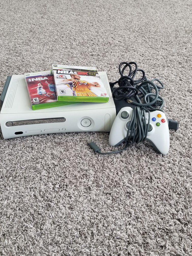 xbox 360 with two games, controller, and all connecting cords in working order
