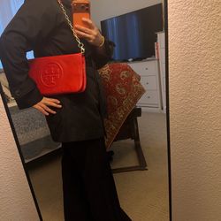 Tory Burch Perry Bombe red leather crossbody / clutch. Embossed Double-T logo, gold chain strap. Classic, elegant, and effortlessly stylish.