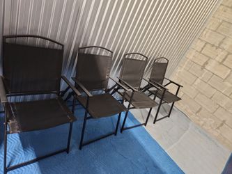 4 folding black chairs