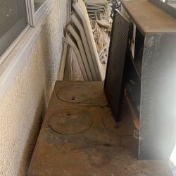 Rustic iron stove . Works