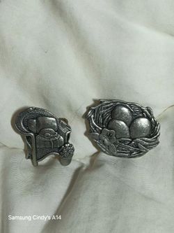 Two souvenir broaches