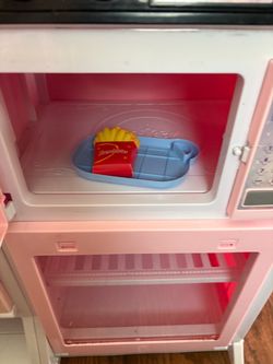 Princes play kitchen  in a pink color