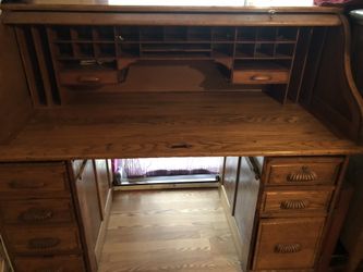Antique oak roll tip desk