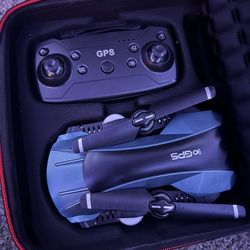 FOLDABLE DRONE WITH CAMERA AND GPS TECHNOLOGY ALSO WORKS WITH PHONE AS WELL AS THE REMOTE 