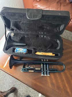 * Brand: Cecilio * Type: Bb trumpet * Finish: Black nickel (blue/black appearance) * Includes: Hard case, mouthpiece, cleaning cloth