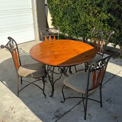Table And 4 Cushion Chairs 