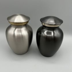 Brand New, Beautiful Pet Urn.  Pewter & Slate Colors.  $20 Each.
