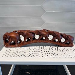 Vintage solid wood hand carved bridge of elephants  5 linked elephants in a bridge formation trunk to tail  12” long x 3” high