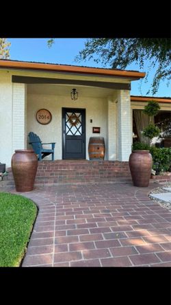 Taller copper New urns 32” H $125 each plant not included