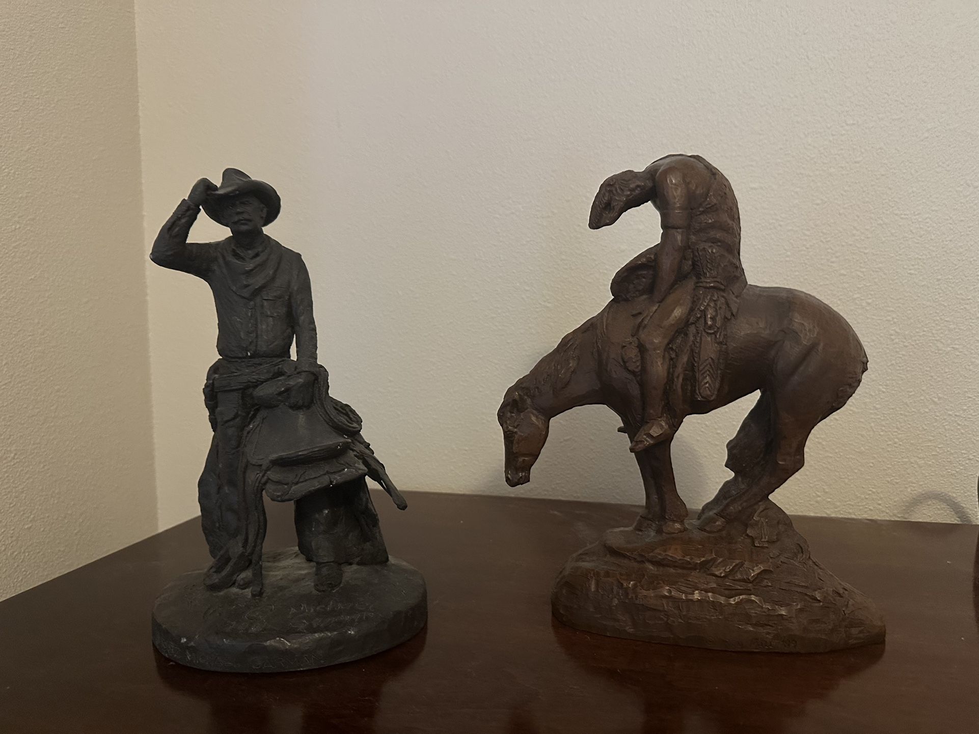 Vintage Michael Garman Cowboy Sculpture called “Drifter” purchased in 1982.  Vintage “End of the Trail” by Red Mill Mfg purchased in 1984.