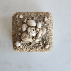 Handmade shell-encrusted jewelry or keepsake box often referred to as shellwork.