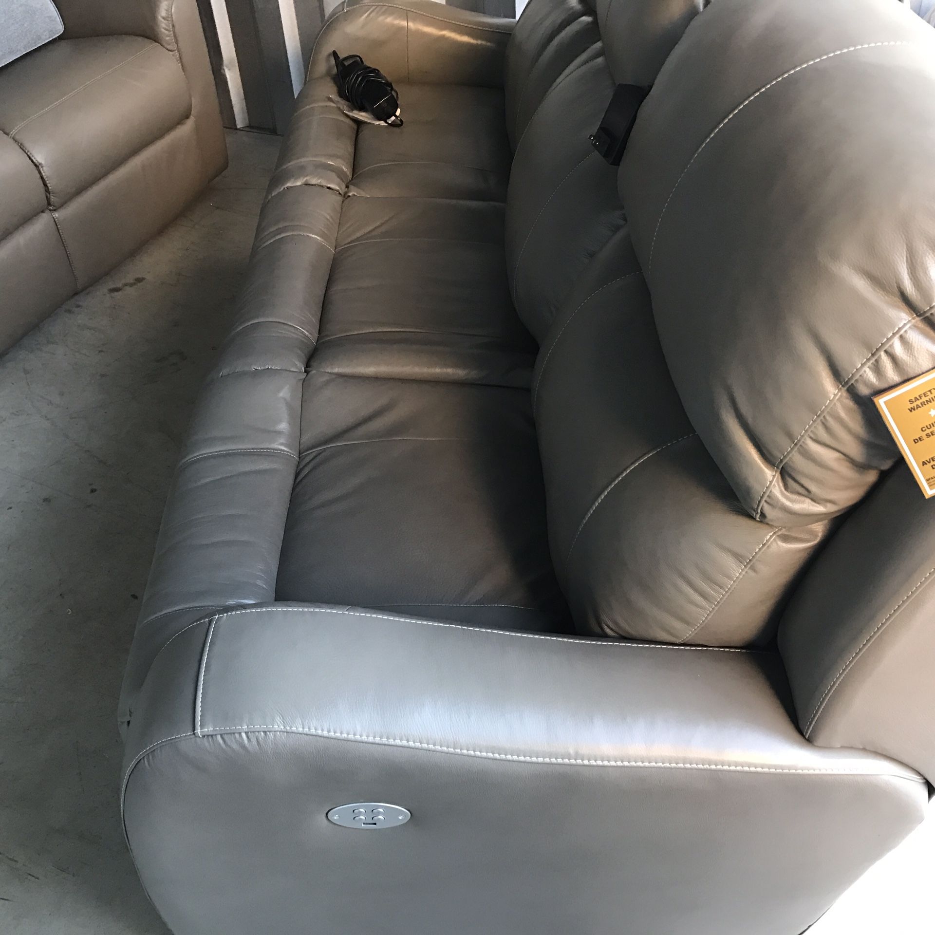 New all power reclining gray all leather high quality couch.