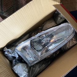 headlight assembly passenger side for mirage coupe 97-02