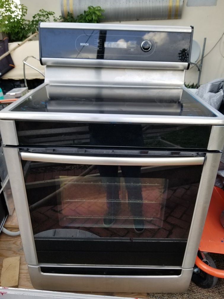 Bosch stainless stove w/oven dishwasher and microwave