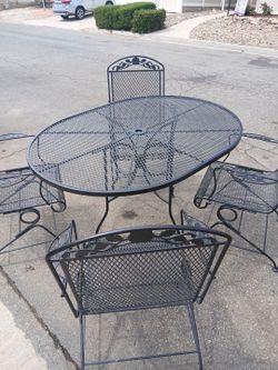 Black patio set solidIron rockers and table