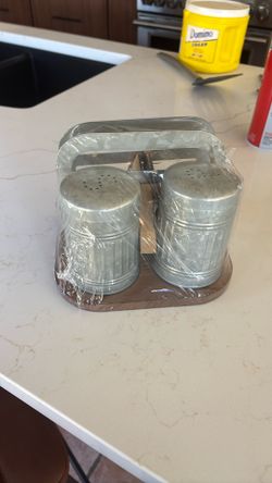 Salt and pepper shakers with napkin holder